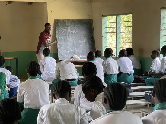 Speaker leading a prayer session with secondary school students, The Gambia, 2022
