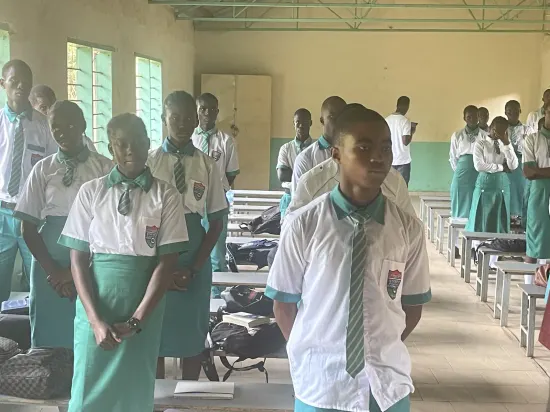 Speaker leading a prayer session with secondary school students, The Gambia, 2022