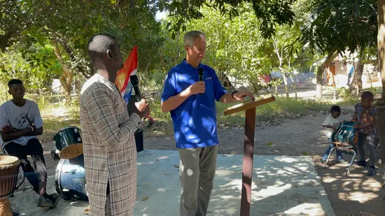 Outdoor community church service under the trees, The Gambia, 2022