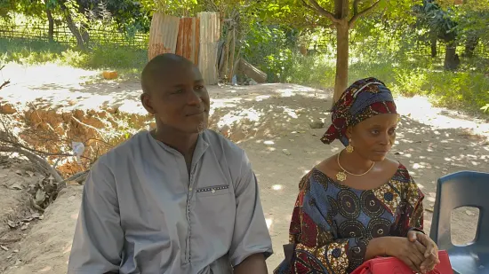 Outdoor community church service under the trees, The Gambia, 2022