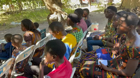 Outdoor community church service under the trees, The Gambia, 2022