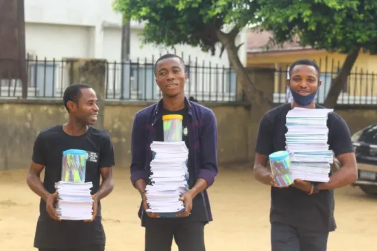 Volunteers carrying books and pens, One Child, One Pen, One Book 2023